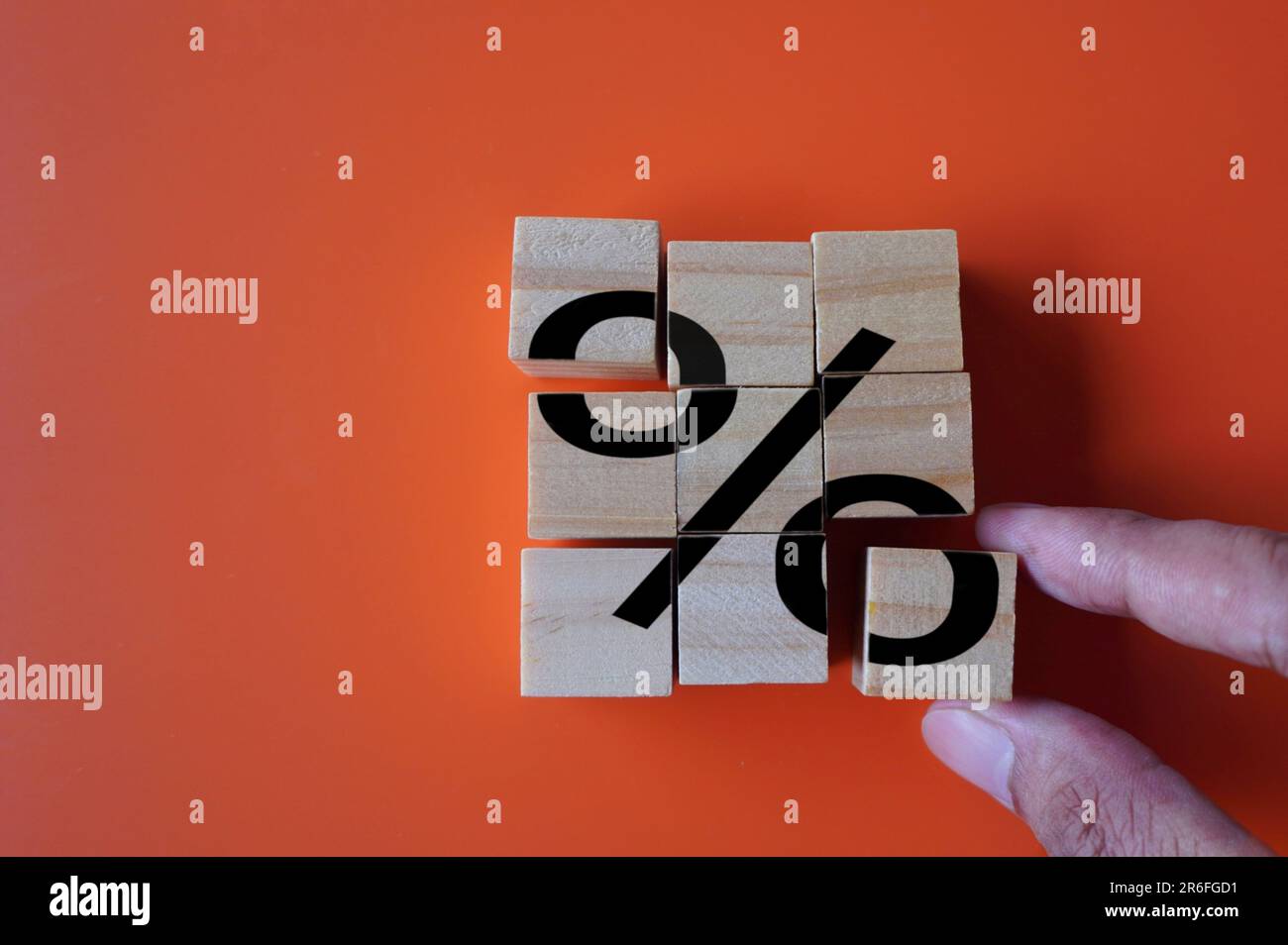 Hand arrange wooden cubes with percentage sign. Debt restructuring, loan refinancing and pay off debts concept Stock Photo