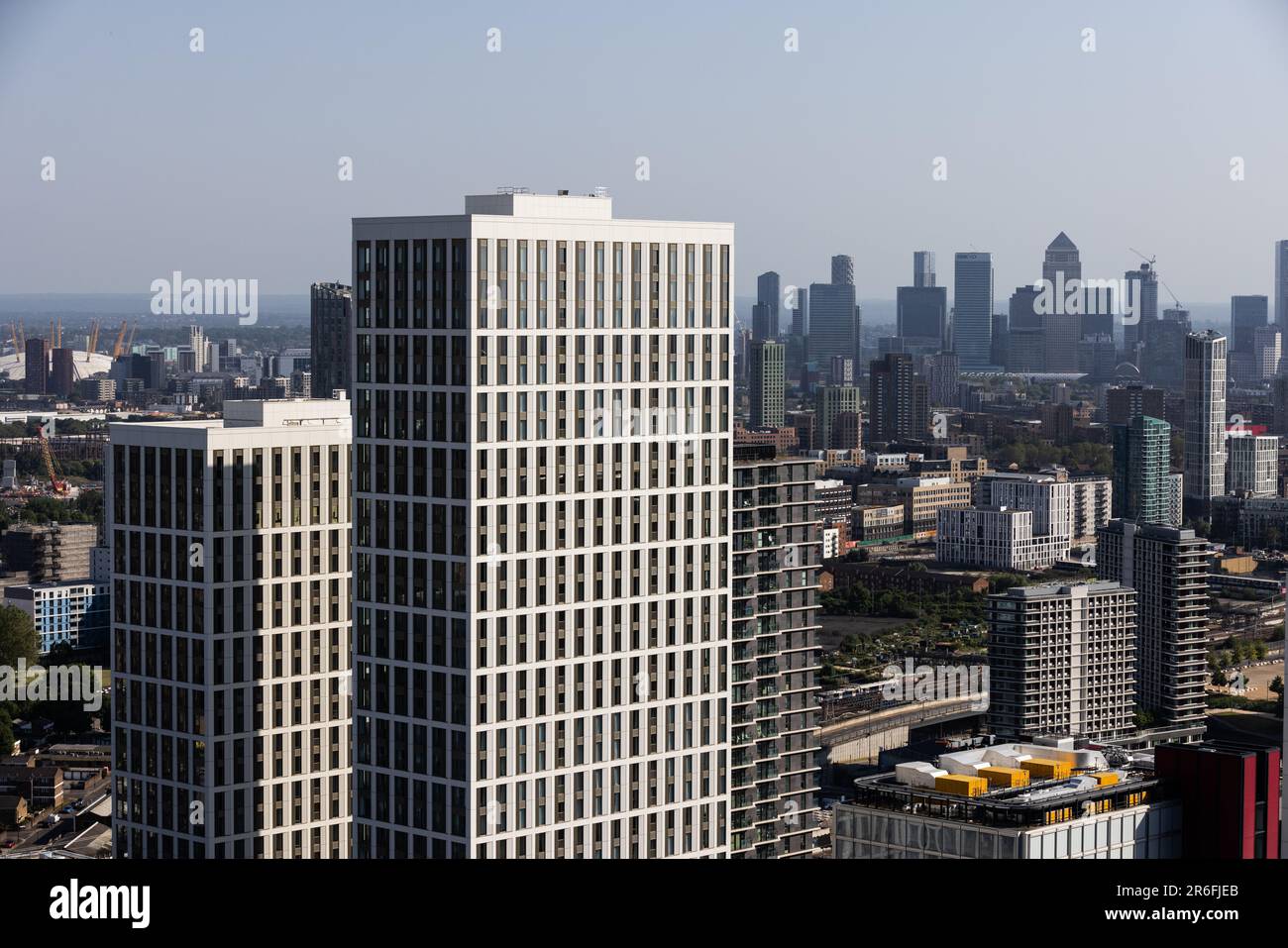 Canary Wharf skyline, financial district of the docklands area of East London on a hot summers day view from a high rise building in Stratford, London. Stock Photo