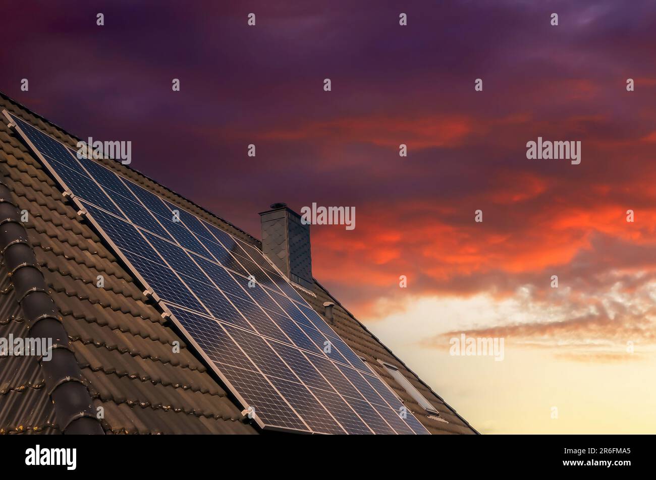 Solar panels producing clean energy on a roof of a residential house ...