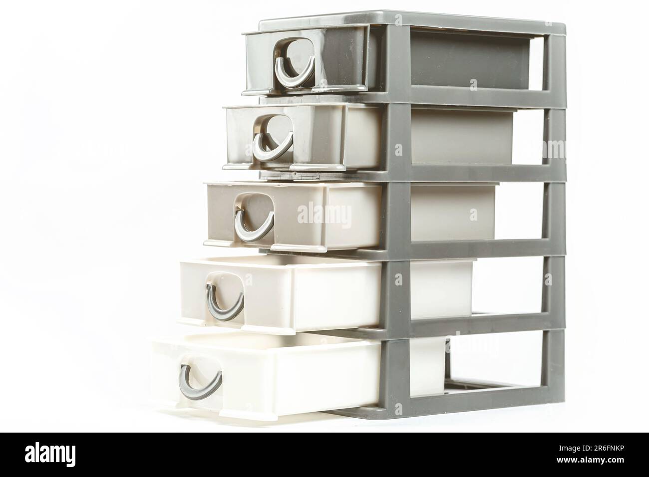 A stack of three plastic containers with metal handles, perfect for