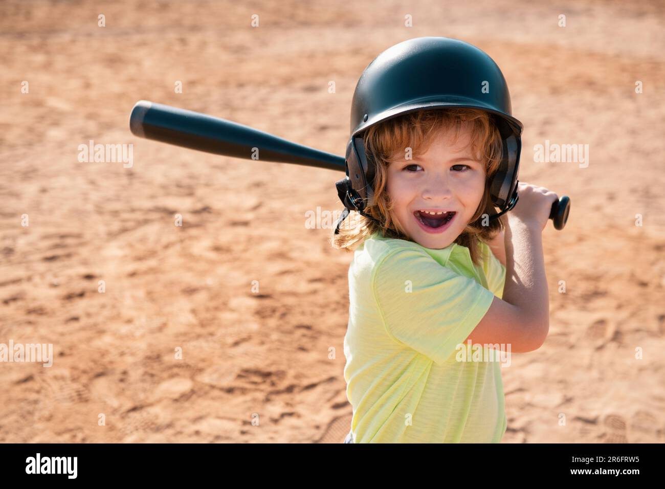 Child baseball player focused ready to bat. Kid holding a baseball bat Stock Photo Alamy