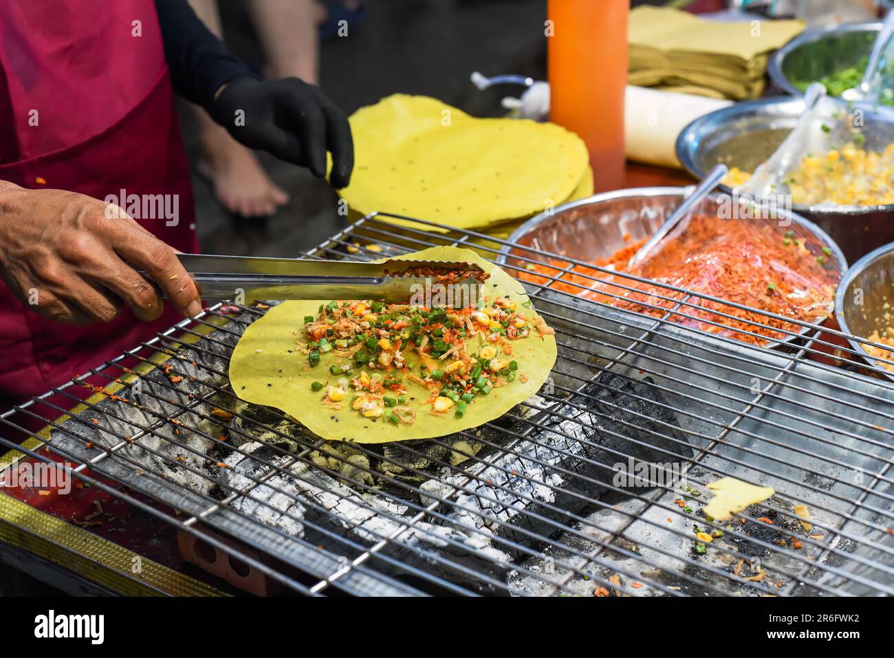 Grilled vietnamese pancake with eggs, sausages and sauces in vietnamese