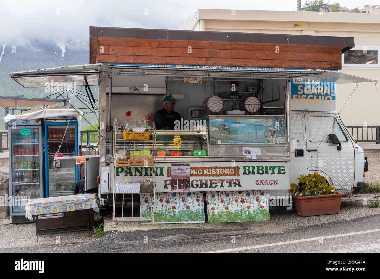 Mobile business selling paninis and snacks from a van in Castelluccio village in Umbria, Central Italy, Europe, a few years after the 2016 earthquake Stock Photo