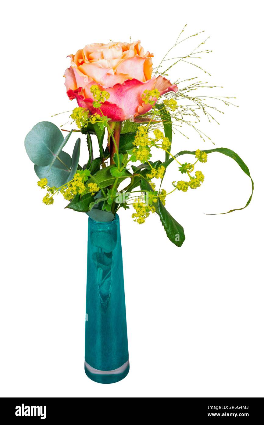 Closeup of an isolated flower arrangement with a rose in a glass vase Stock Photo