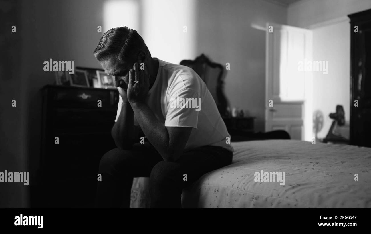 Older man suffering in quiet despair struggling with mental problems in ...