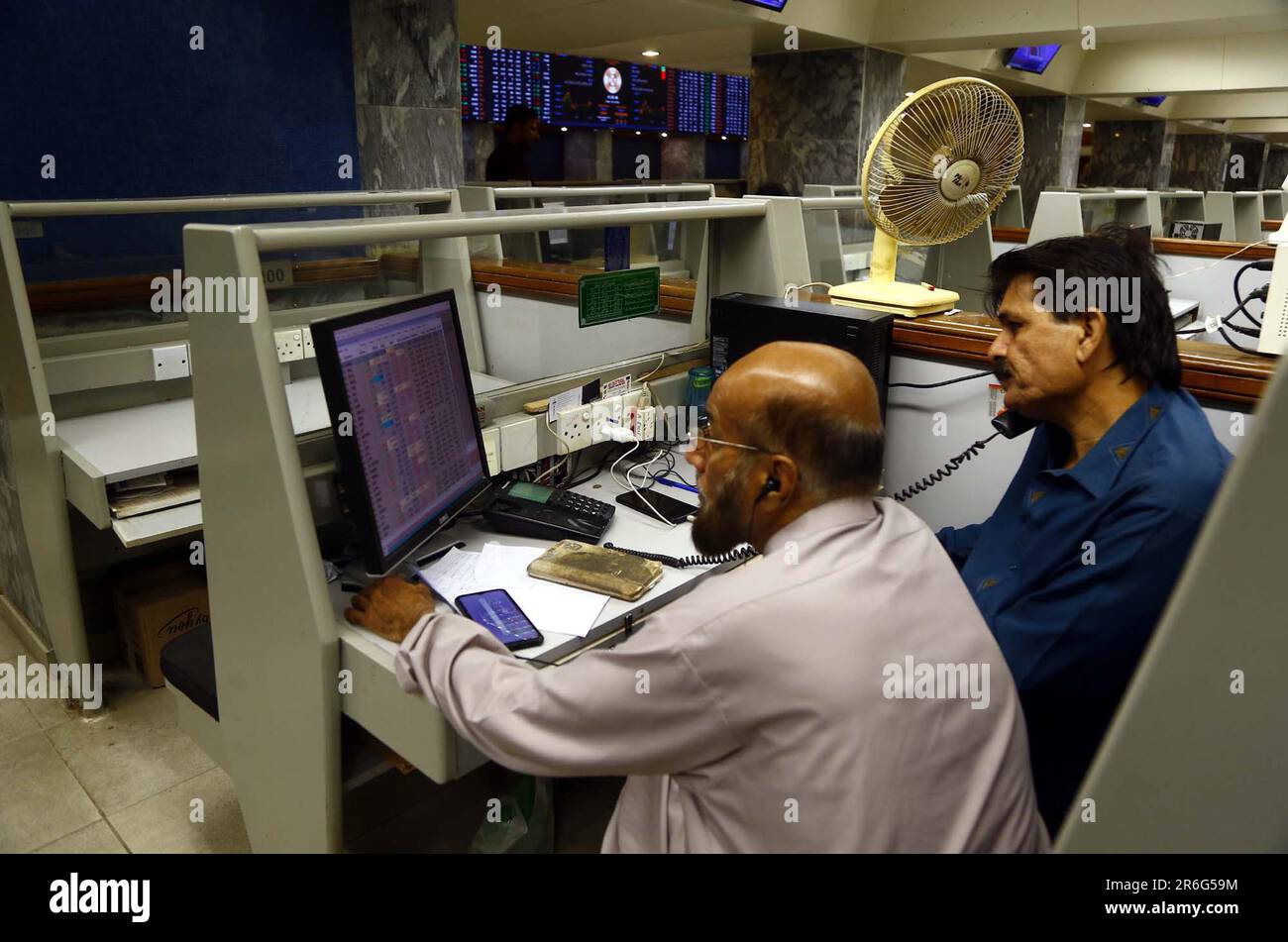 Brokers are busy in trading at Pakistan Stock Exchange (PSX) in Karachi on Friday, June 9, 2023. The Pakistan Stock Exchange (PSX) concluded the week on a positive and optimistic note, with a notable gain of 217.74 points. Investors eagerly anticipated positive outcomes from the upcoming budget, leading to a strong and promising session. Credit: Asianet-Pakistan/Alamy Live News Stock Photo