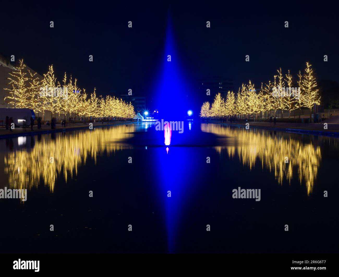 Christmas tree lights reflecting in water fountain Stock Photo Alamy