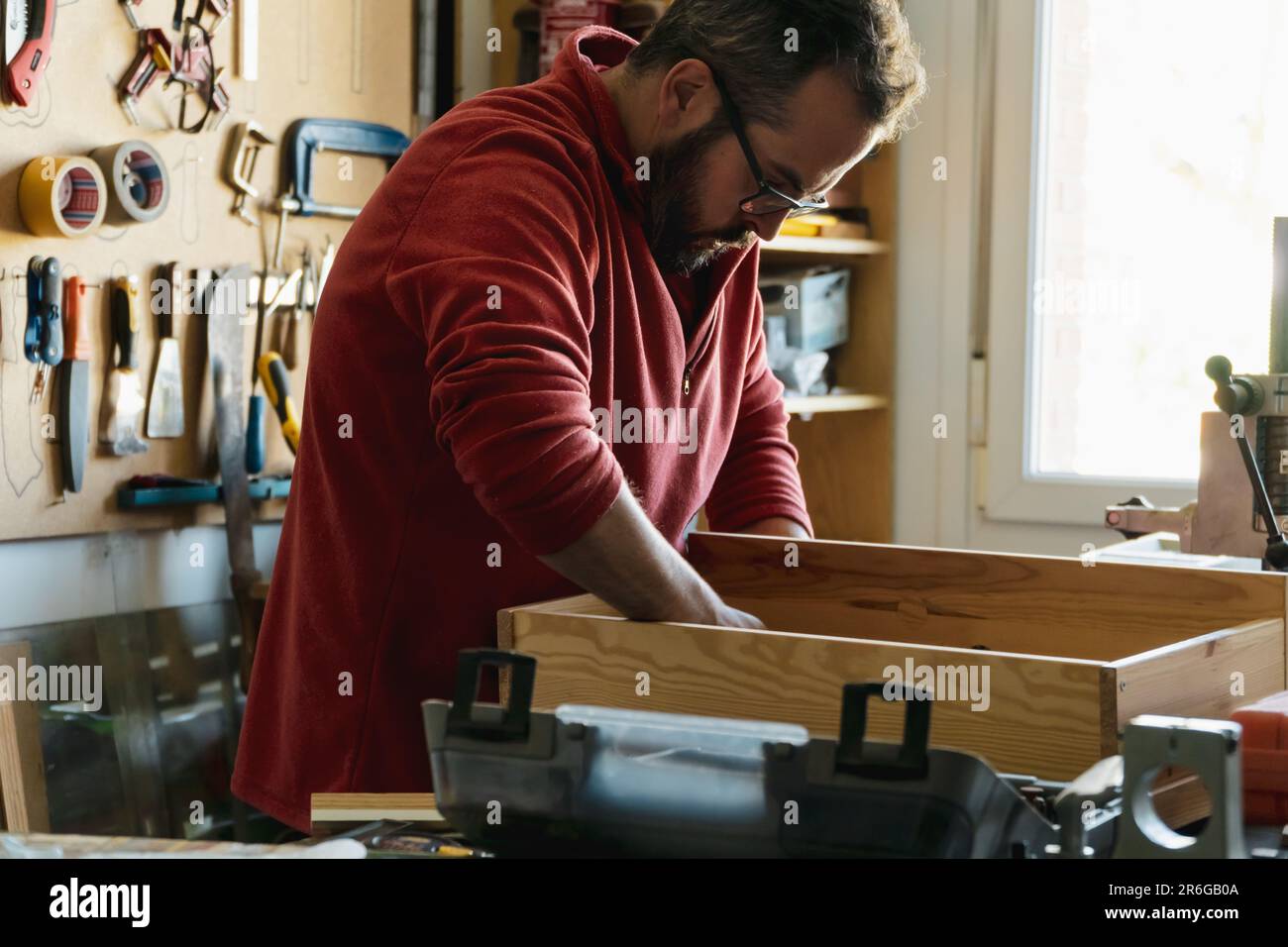 professional carpenter man working with woodwork industry tool