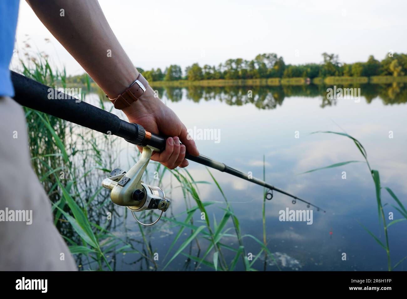 Fisherman holding rod hi-res stock photography and images - Alamy