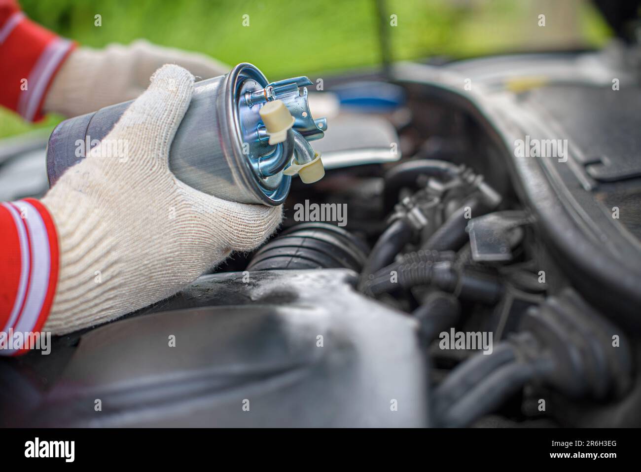 Replacing the fuel filter of car. Stock Photo