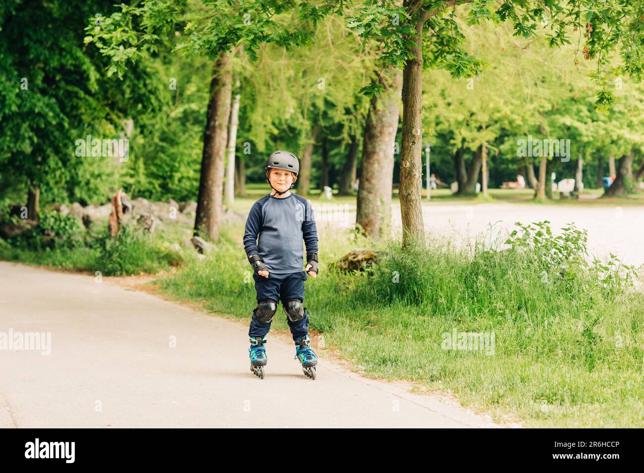 Active little boy skating in summer park, healthy lifestyle for children Stock Photo