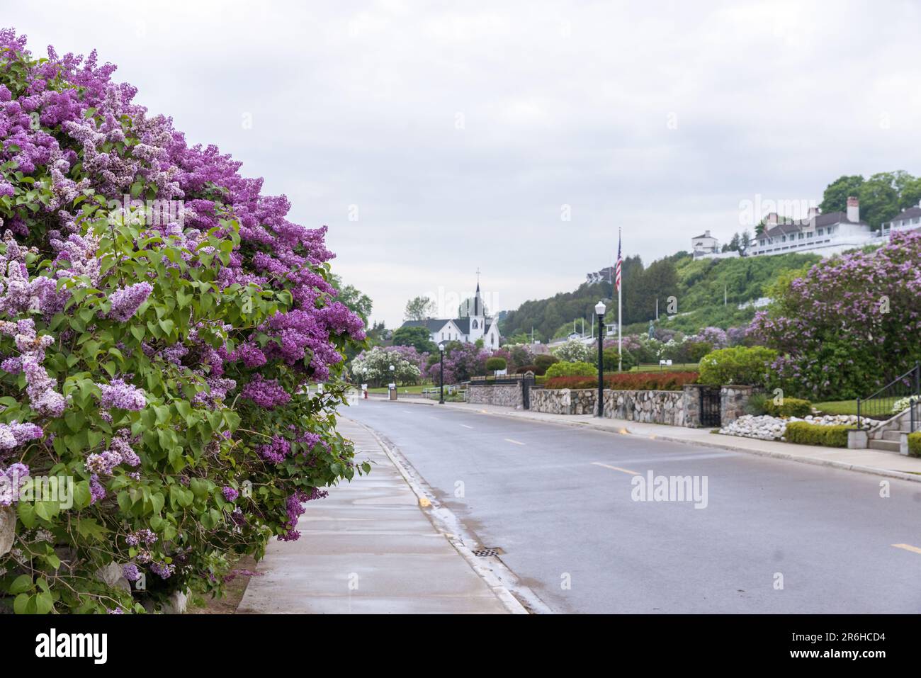 Surnise over lilacs blooming in front of Marquette Park on Mackinac Island Stock Photo