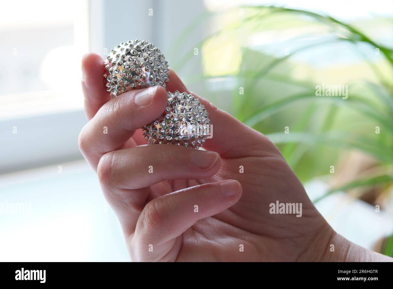 Silver metal balls, spiky tool for hand massage. Therapy Tool