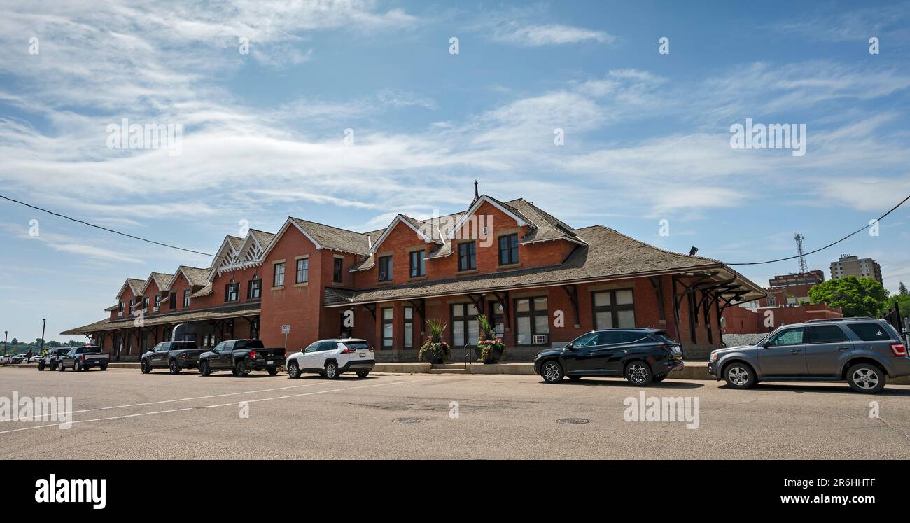 Medicine Hat, Alberta, Canada – June 06, 2023:  Street view of the historic red brick train station in the downtown Stock Photo