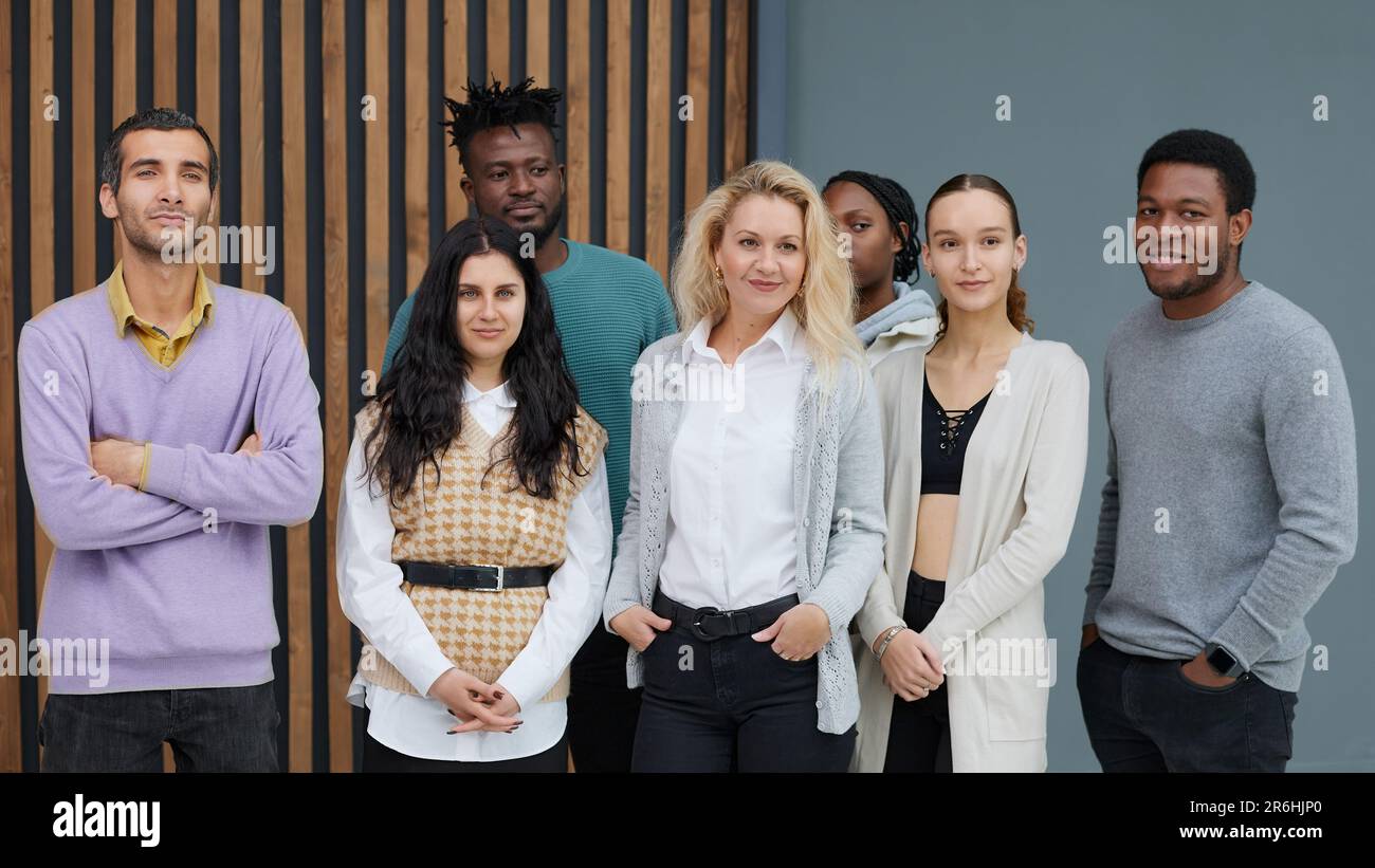 Group of business people standing of a modern office Stock Photo - Alamy