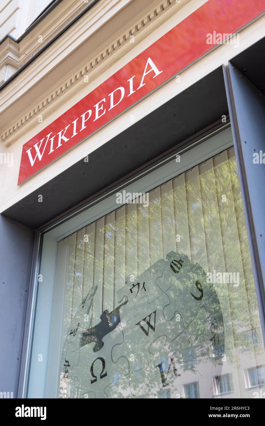 Wikipedia sign and logo is displayed on front of WikiBär workspace in Berlin. Stock Photo