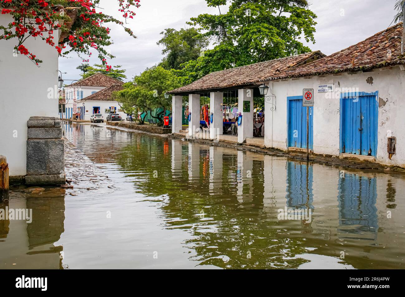 Typical street with colonial buildings under water during high tide in