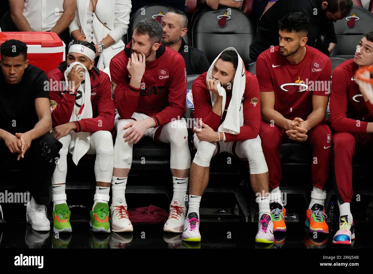 Miami Heat players sit on the bench at the end of Game 4 of the