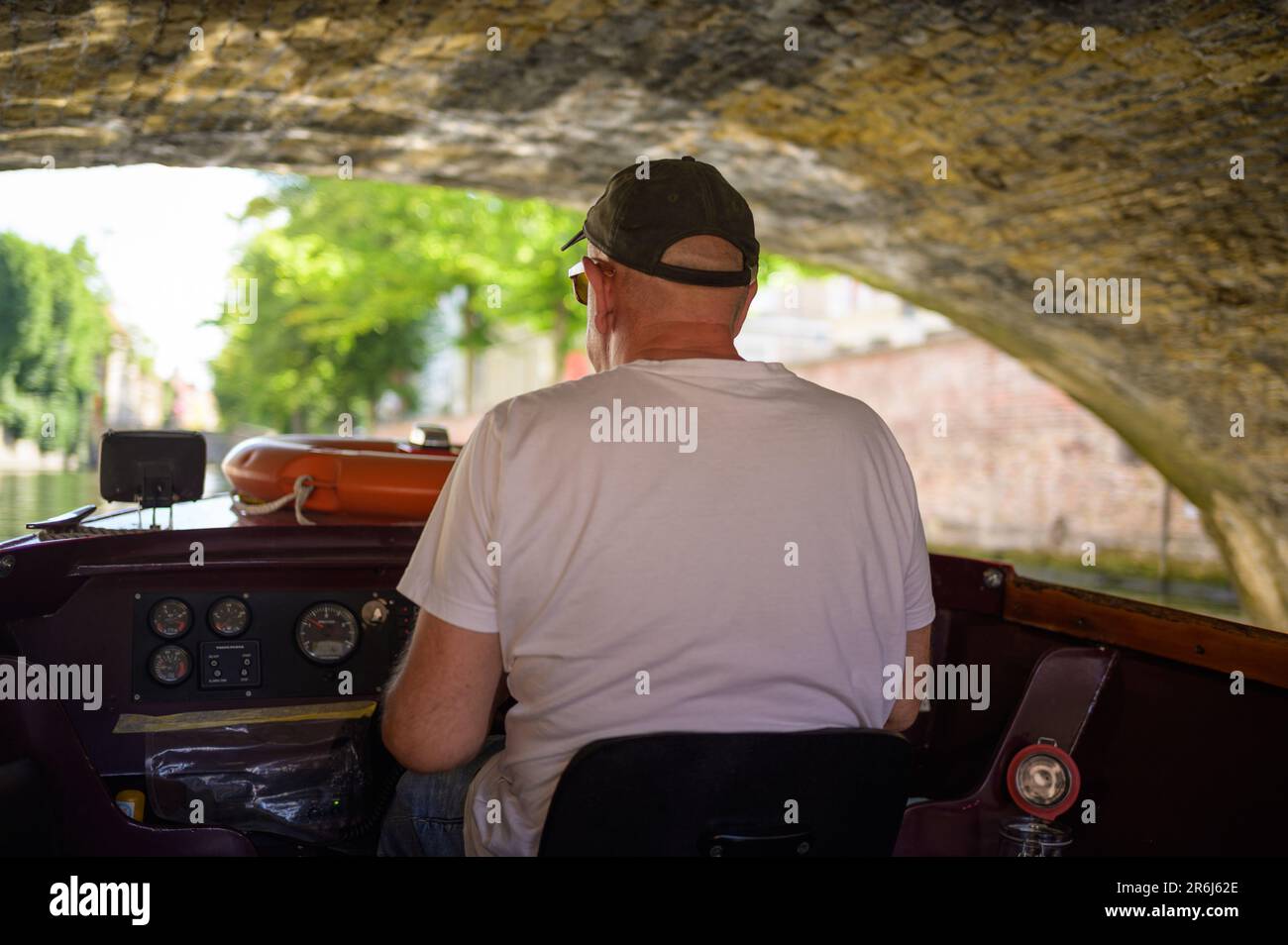 Old man driving boat hi-res stock photography and images - Alamy