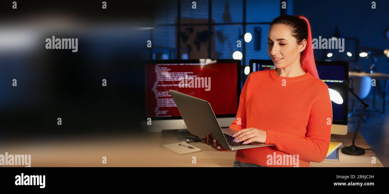 Female programmer working in office at night. Banner for design Stock ...