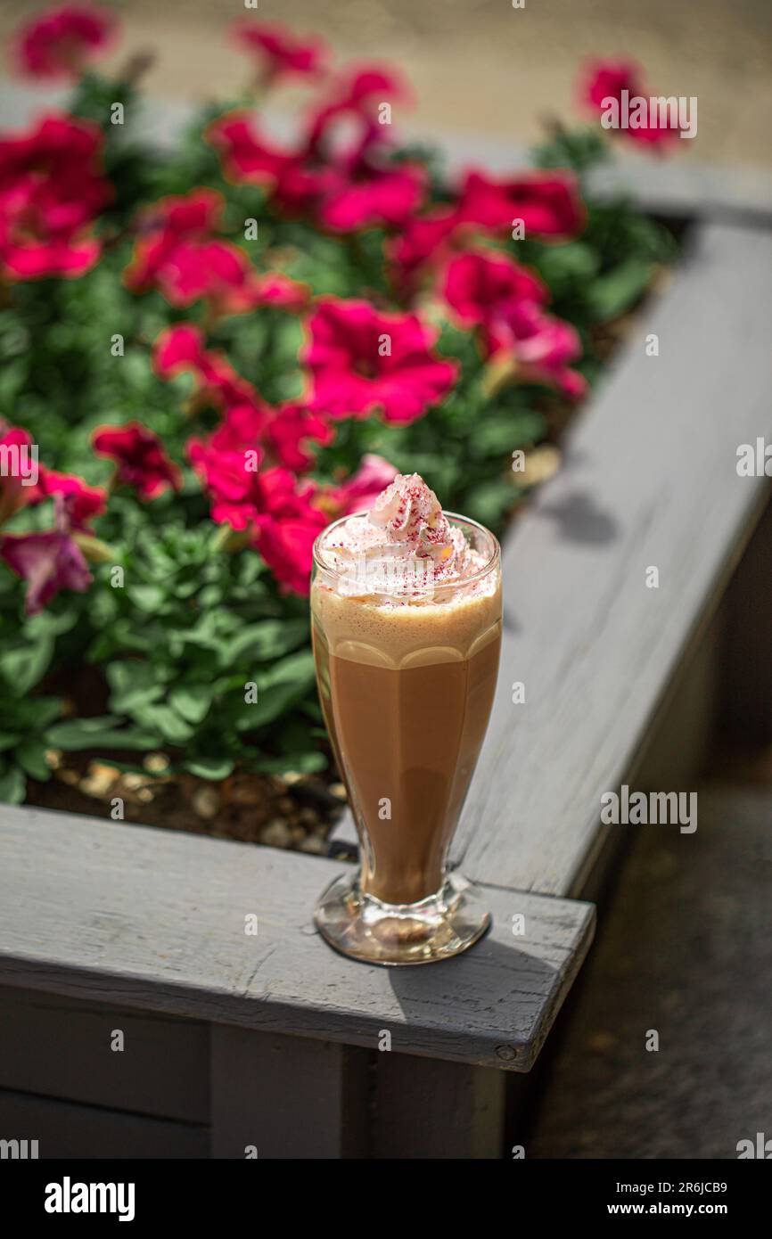 Portion of sweet coffee frappe in the garden Stock Photo