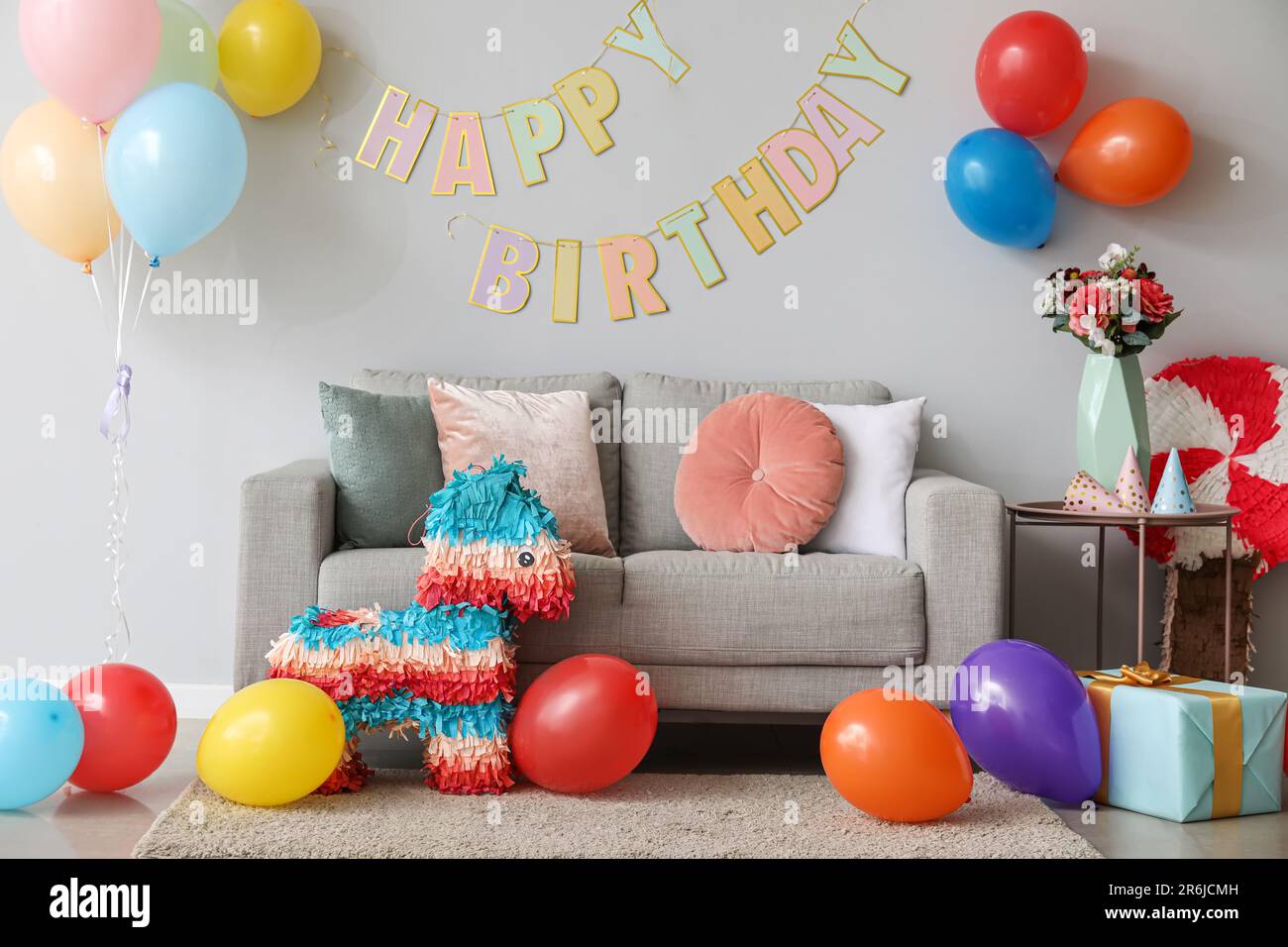 Interior of living room decorated for birthday with balloons ...