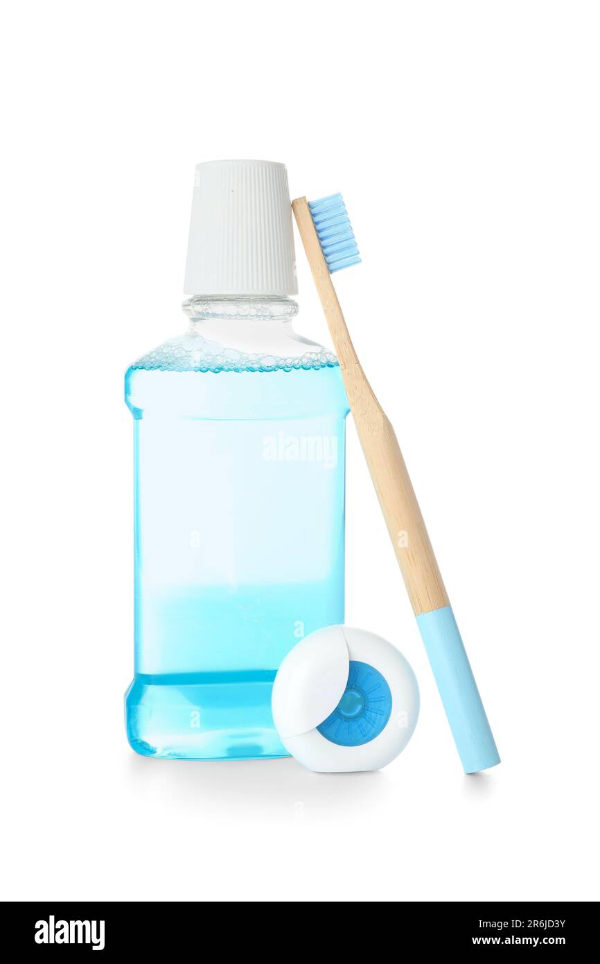 Dental floss, toothbrush and mouthwash isolated on white background