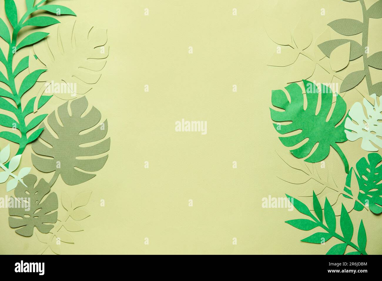 Frame made of different tropical leaves on pale green background Stock ...