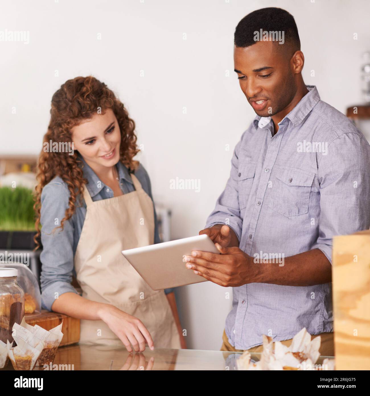 Tablet, cafe owner and teamwork of people talking, discussion and