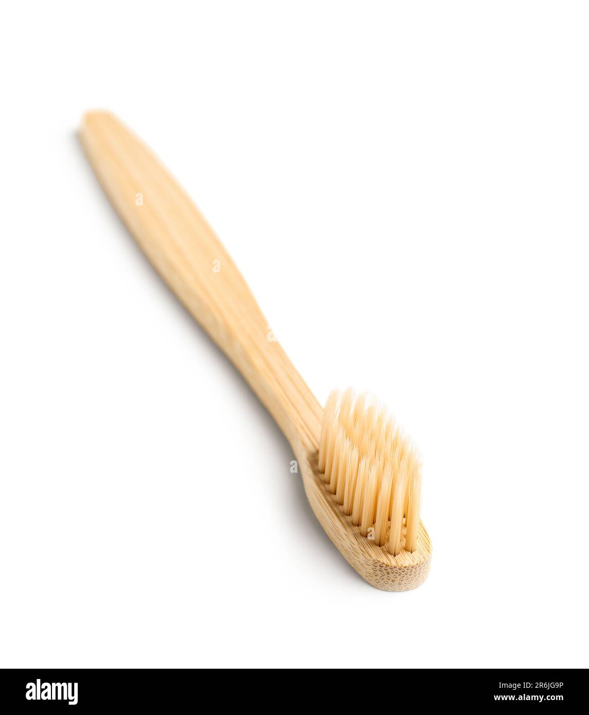 Bamboo toothbrush on white background Stock Photo - Alamy