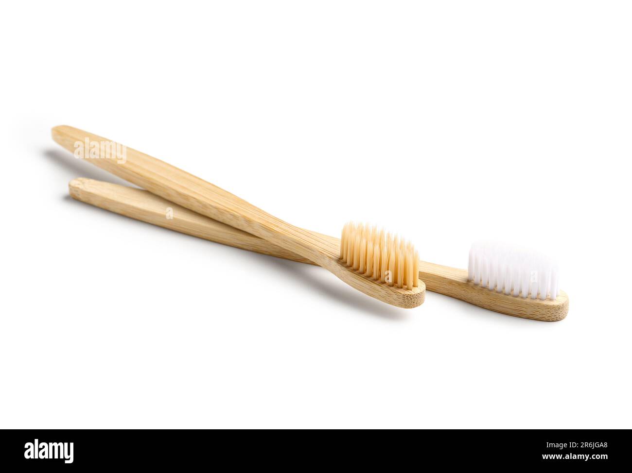 Different bamboo toothbrushes on white background Stock Photo - Alamy