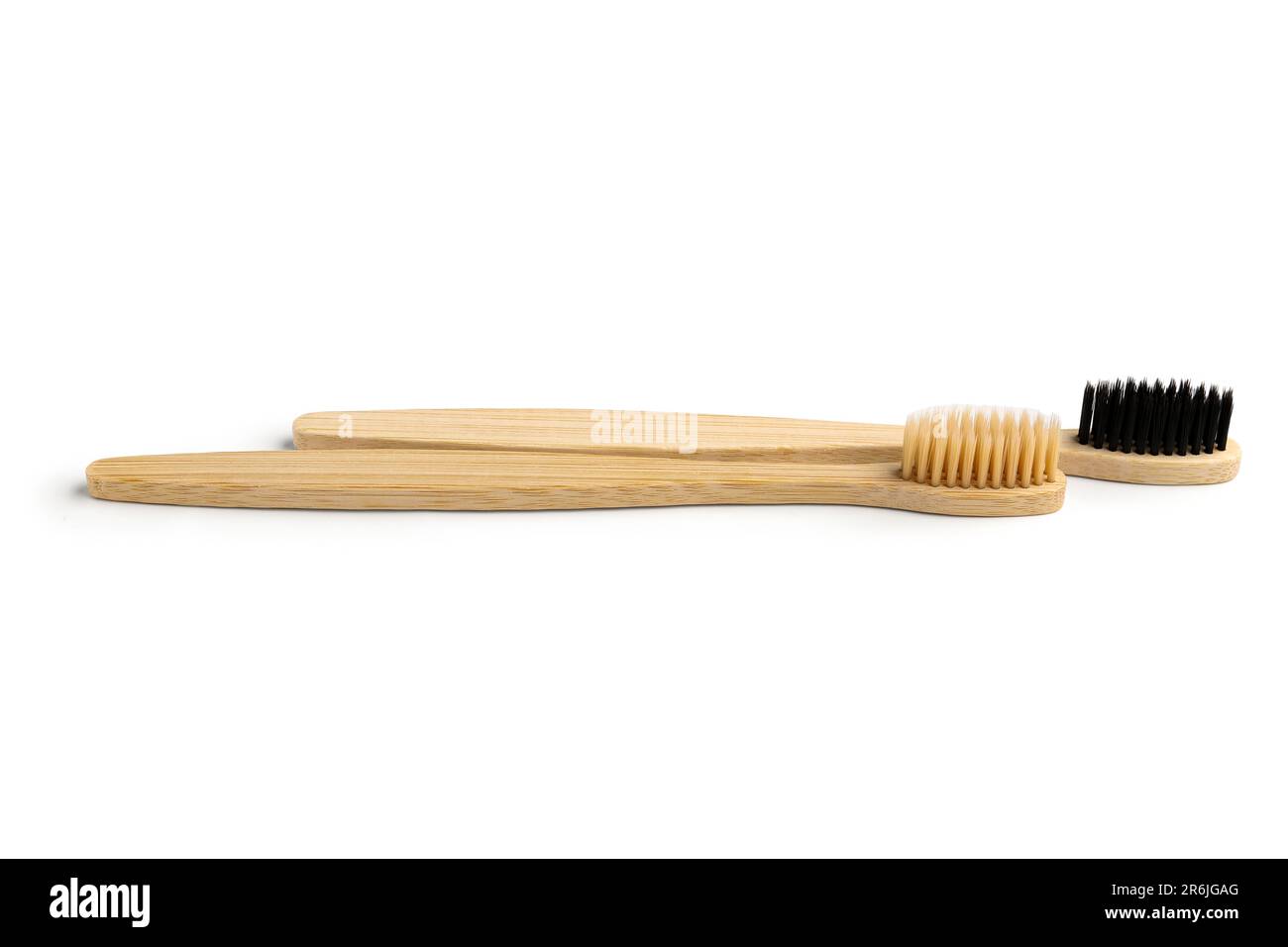 Different bamboo toothbrushes on white background Stock Photo - Alamy
