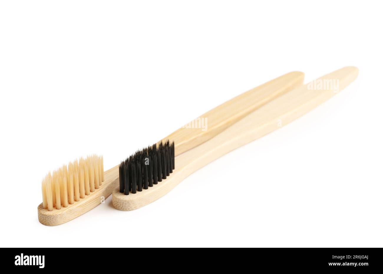 Different bamboo toothbrushes on white background Stock Photo - Alamy