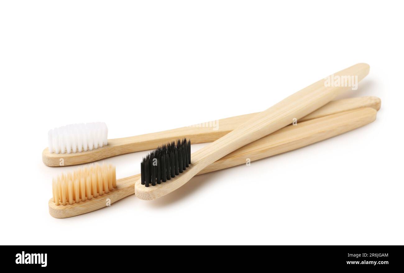 Different bamboo toothbrushes on white background Stock Photo - Alamy