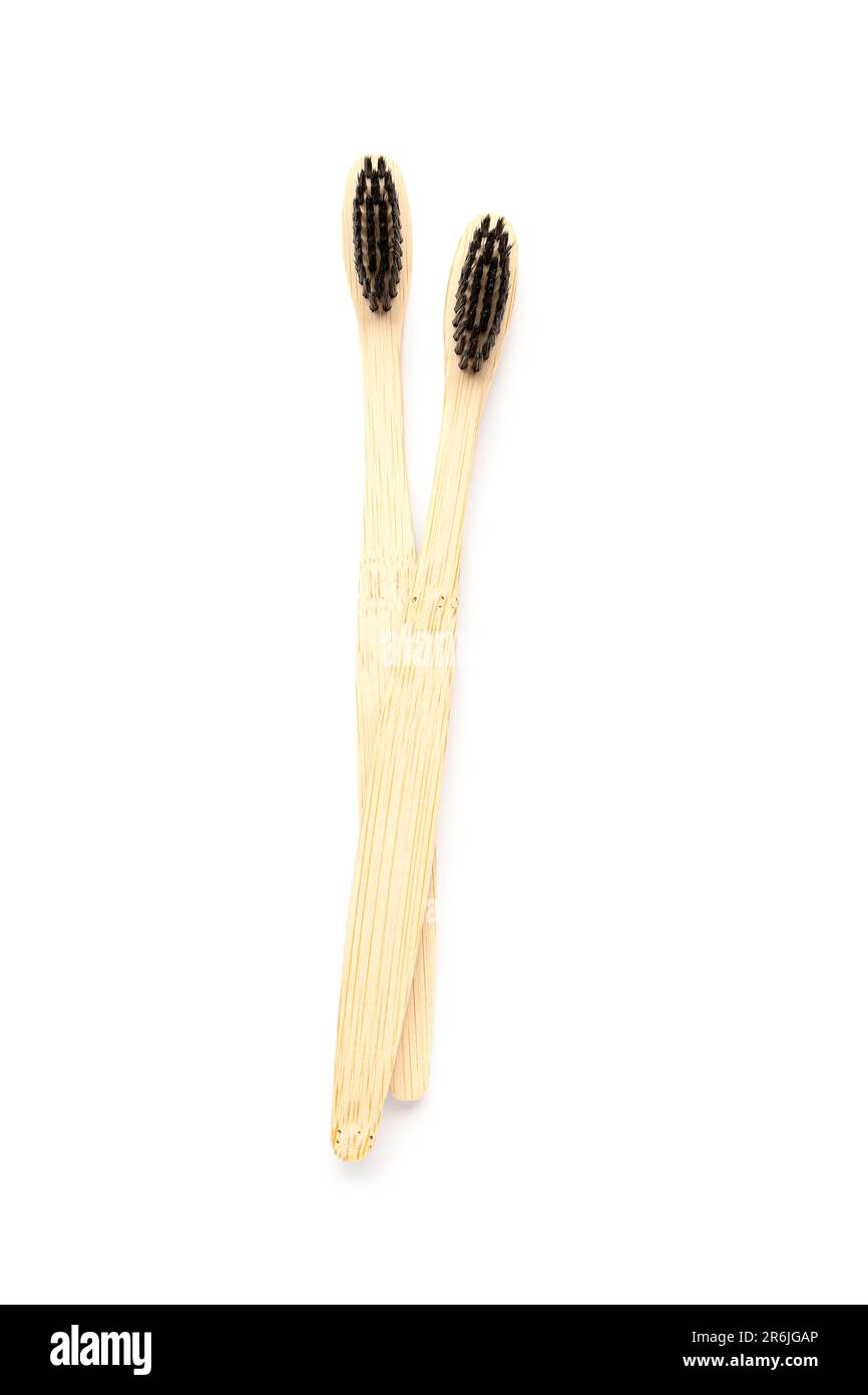 Bamboo toothbrushes on white background Stock Photo - Alamy