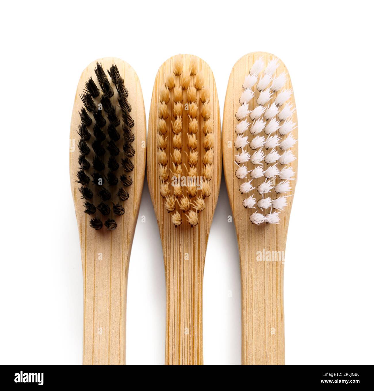 Different bamboo toothbrushes on white background Stock Photo - Alamy