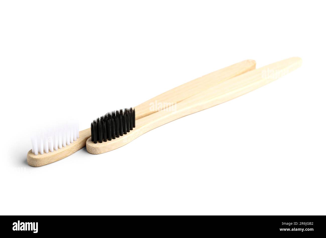 Different bamboo toothbrushes on white background Stock Photo - Alamy