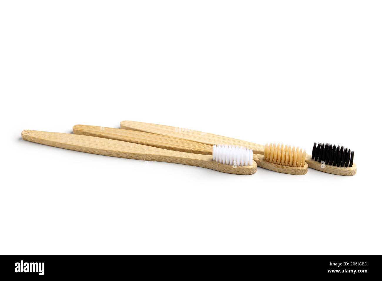 Different bamboo toothbrushes on white background Stock Photo - Alamy