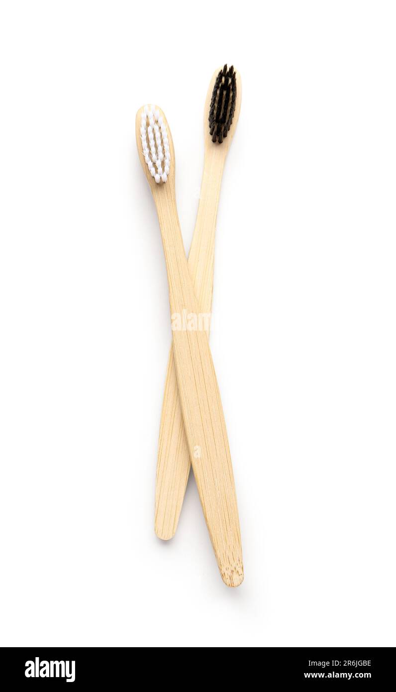 Different bamboo toothbrushes on white background Stock Photo - Alamy