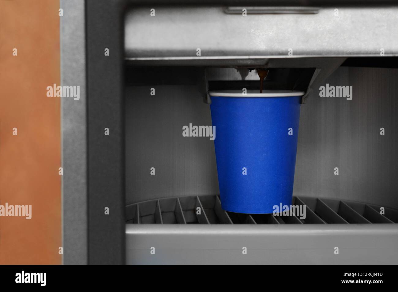 Vending machine pouring coffee in paper cup, closeup Stock Photo - Alamy