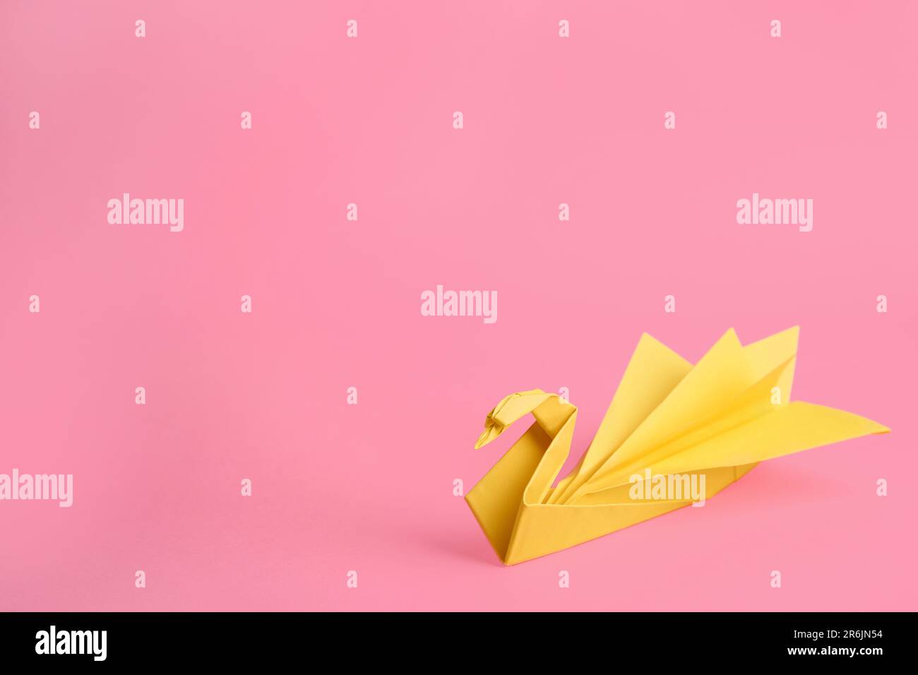 Pink Swan Rice Paper Origami art. Beautiful paper swan on pink background, space for text ...