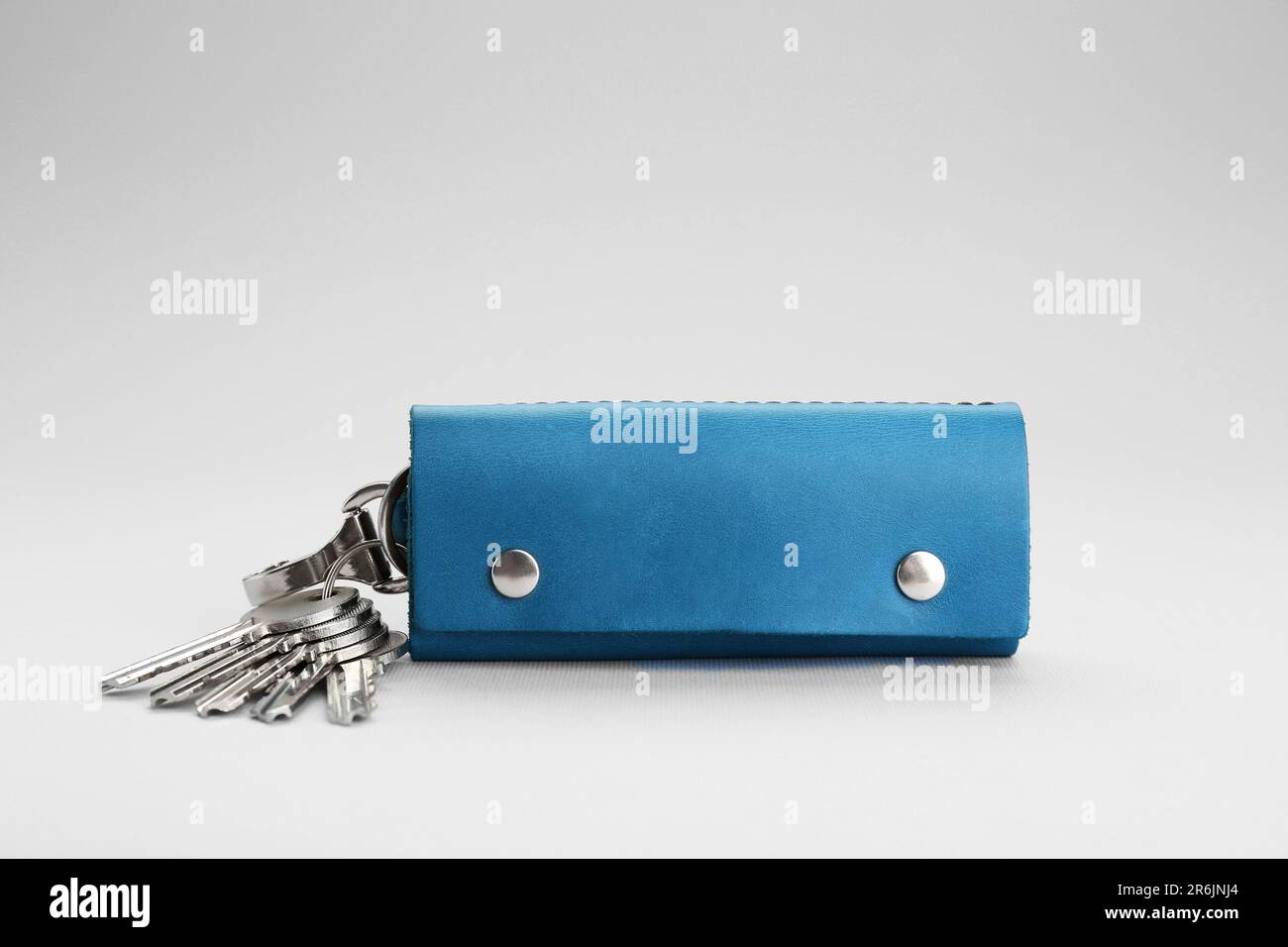 Leather case with keys on light grey background Stock Photo