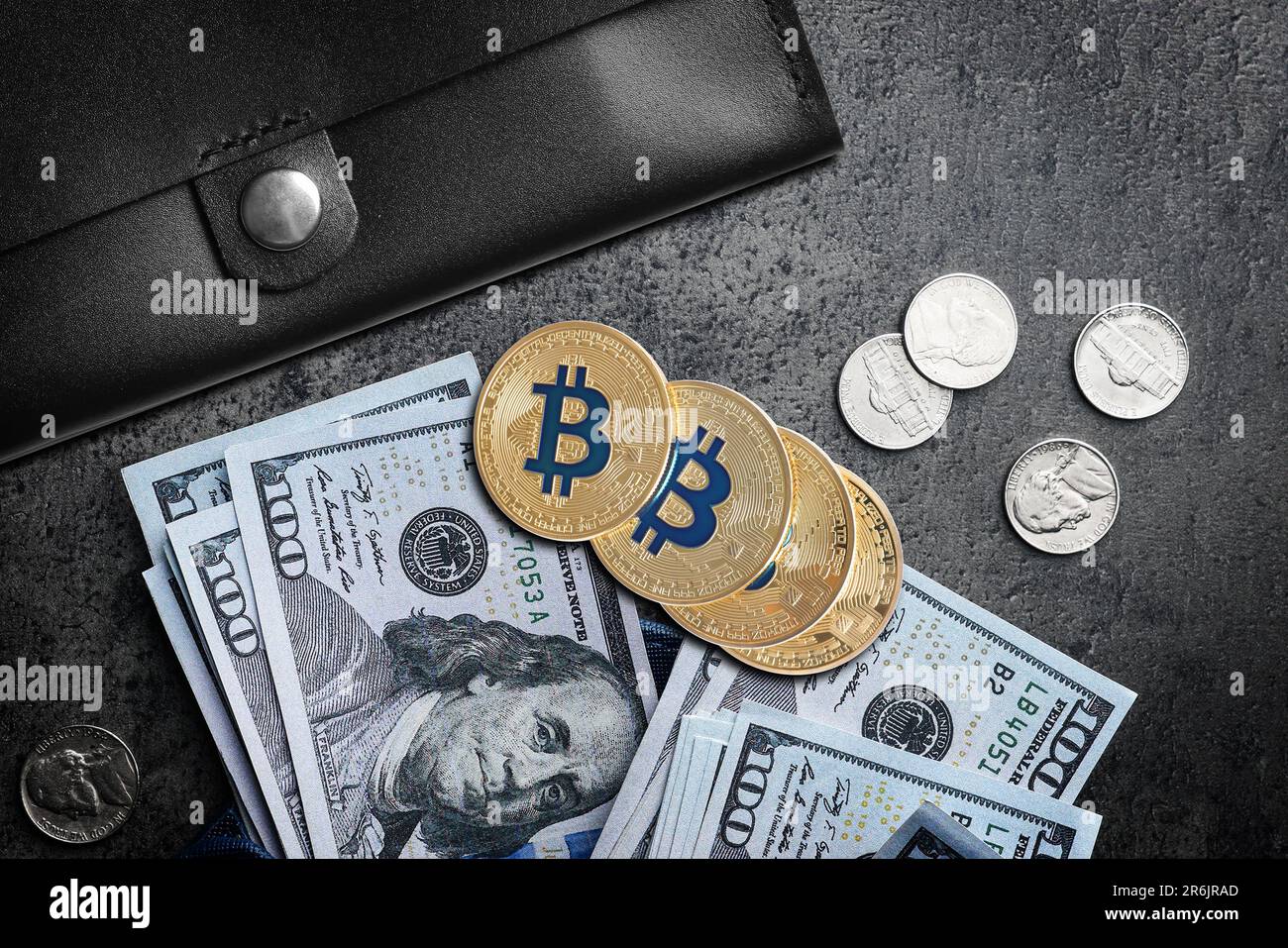 Bitcoin coins on a bundle with dollars. The concept of investing money in  cryptocurrency and making a profit due to the fall in the dollar exchange  ra Stock Photo - Alamy