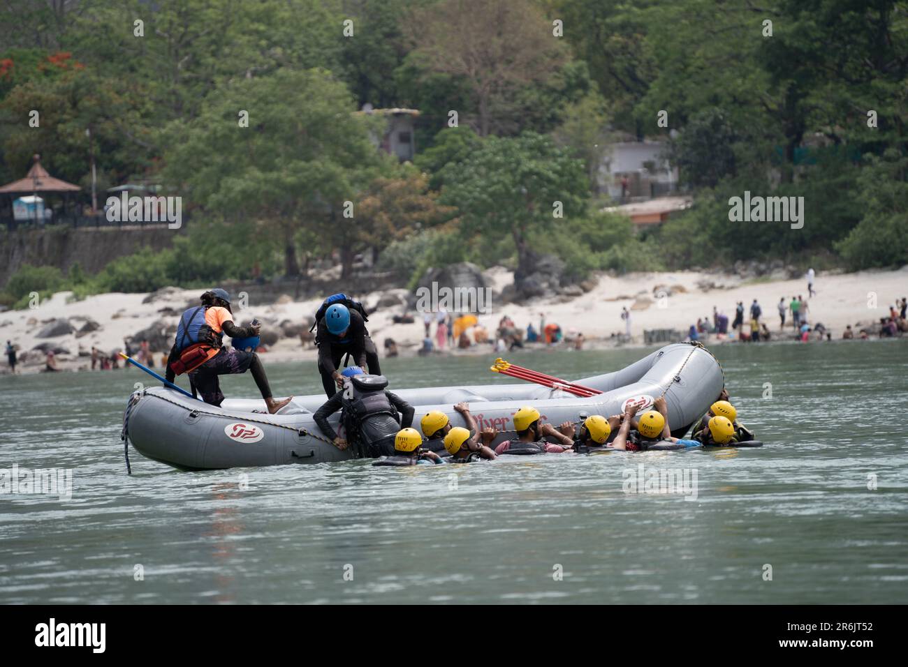 group of people, friends, family floating in blue green cool water of ...