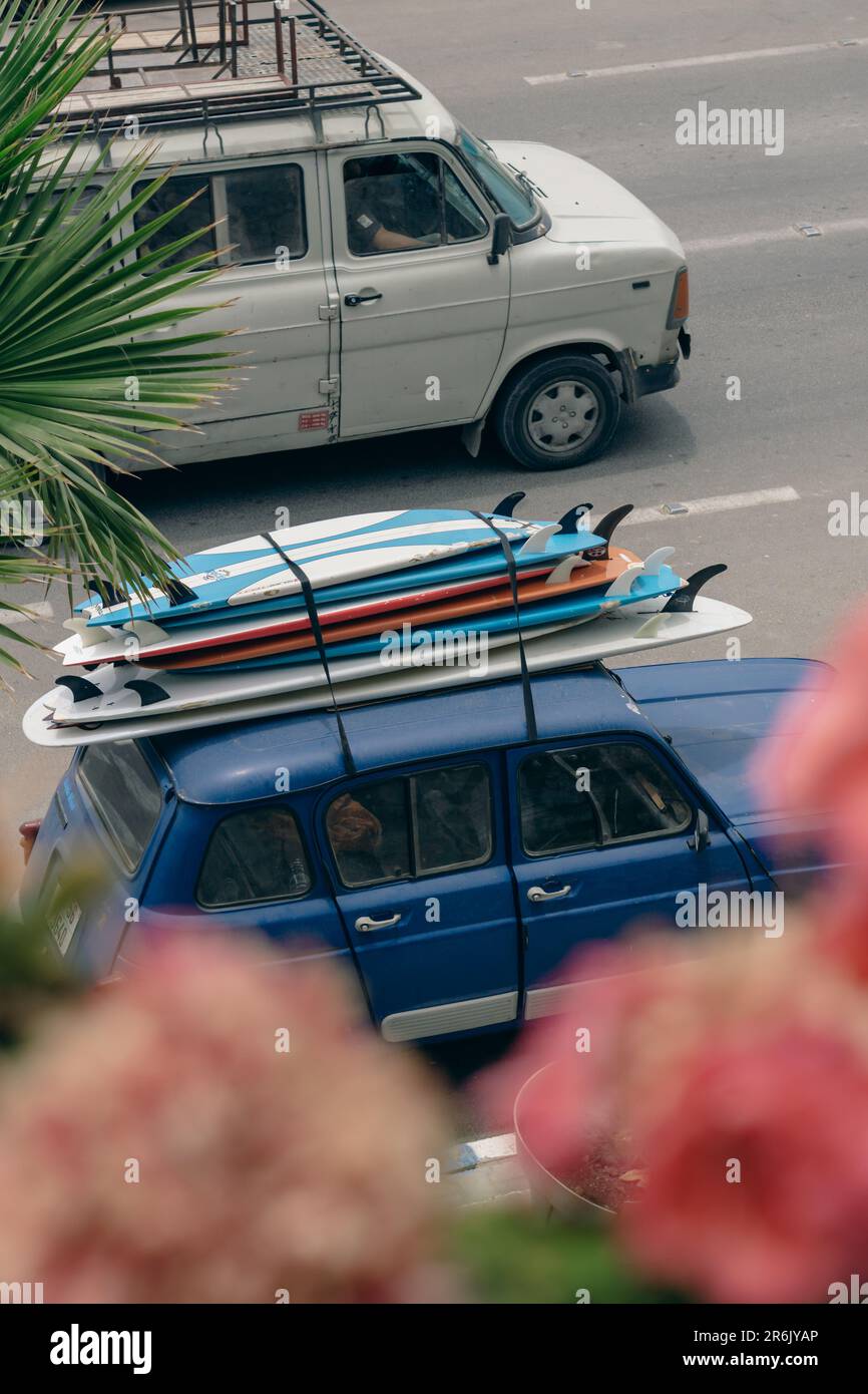 Surfboards stacked on top of car in Taghazout, Morocco Stock Photo