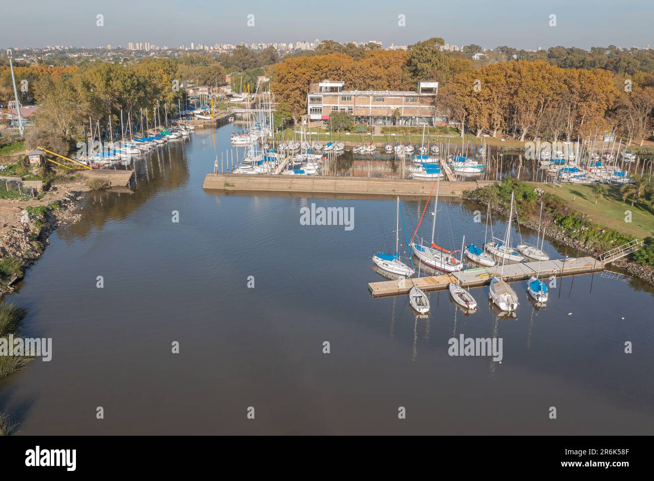 Sailboats docked at a pier on the coast of the Rio de la Plata in the city of Quilmes. Stock Photo