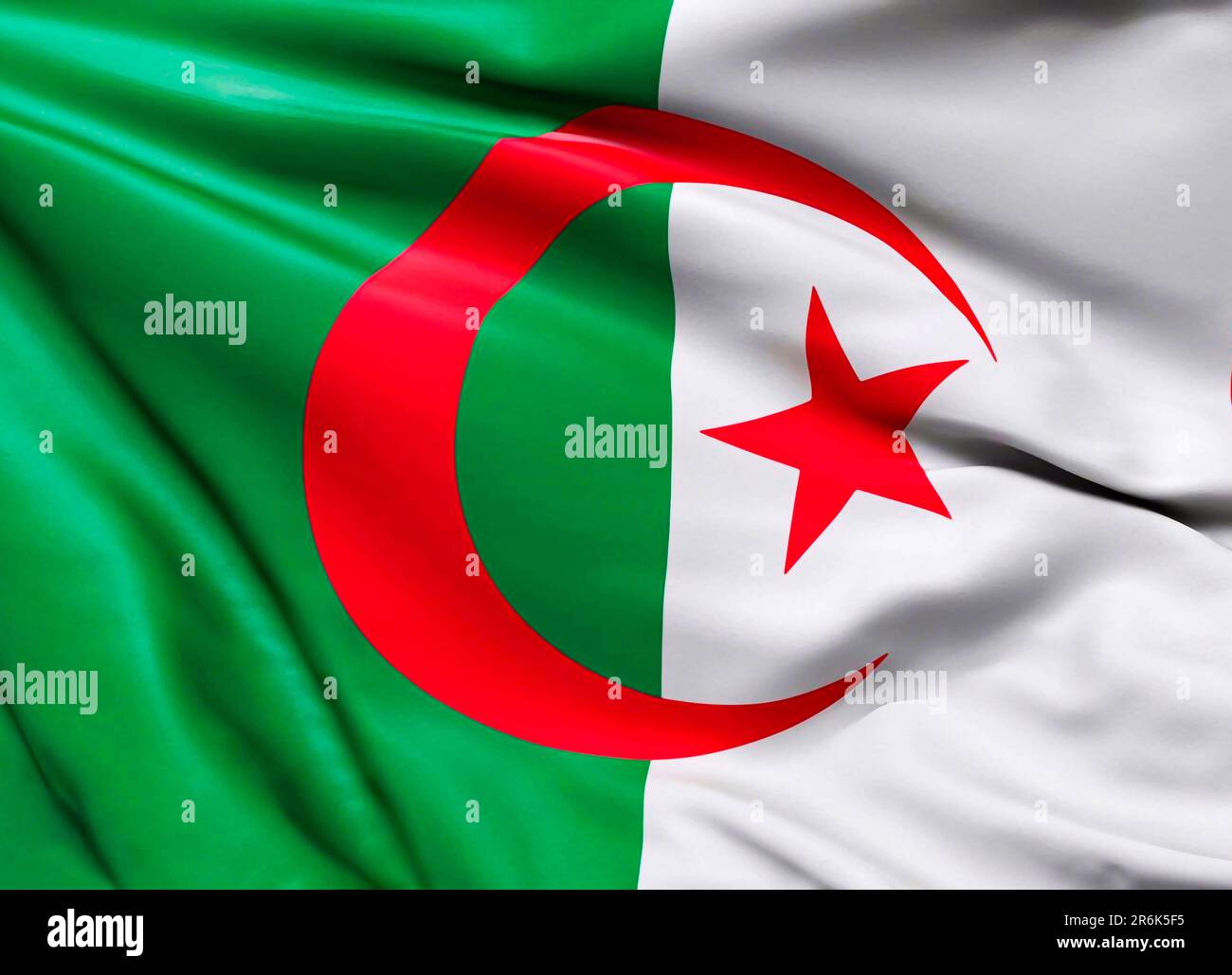 Algeria flag with big folds waving close up under the studio light indoors. The official symbols and colors in fabric banner Stock Photo