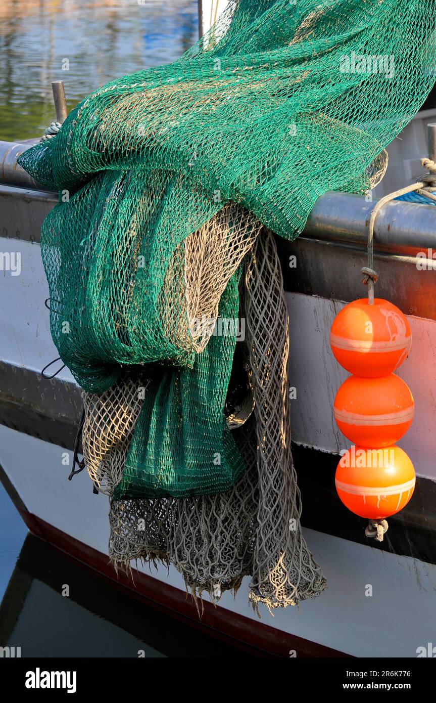 Fishing from the pier or fishing wharf with fishing net and rod at Adriatic  sea in Italy Stock Photo - Alamy