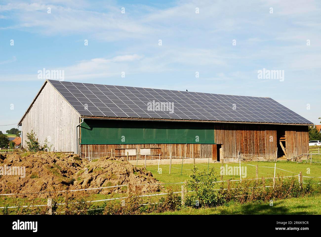 Old barn with photovoltaic on the roof Stock Photo