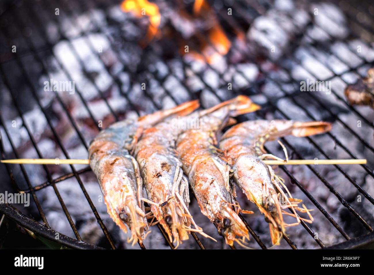 Grilling large king prawns. Charcoal-grilled shrimp. Stock Photo